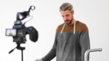 Adult male chef recording a video blog