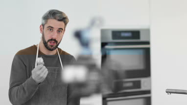 Adult male chef recording a video blog