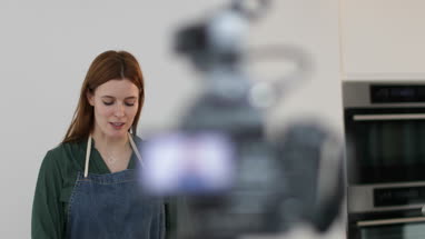 Adult female chef recording a video blog