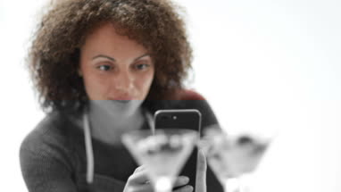 Female food blogger taking a photo with smartphone