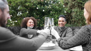 Friends eating a meal outdoors