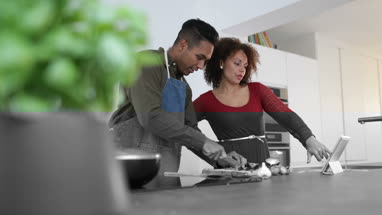 Adult male preparing using digital tablet