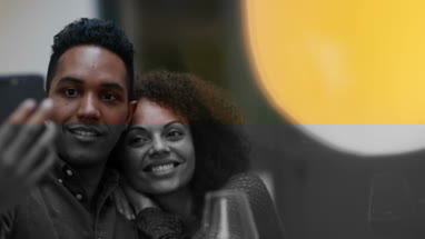 Couple taking a selfie at a celebration