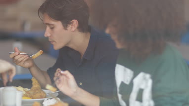 Friends eating fish and chips