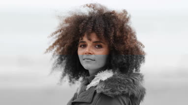 Portrait of young female on a winter beach break