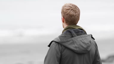 Portrait of young male on a winter beach break
