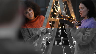 Friends decorating an alternative christmas tree