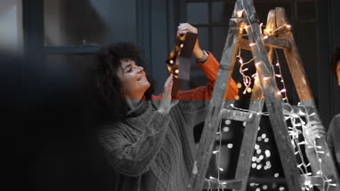 Couple decorating an alternative christmas tree