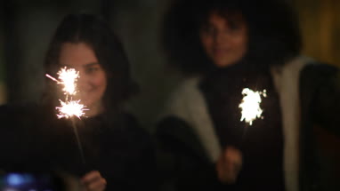 Friend videoing with smartphone sparklers