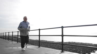 Active senior woman outdoors exercising