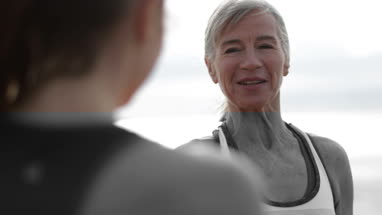 Senior woman and daughter looking at a smartphone