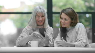 Senior couple looking at a smartphone together