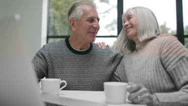 Senior couple relaxing on sofa