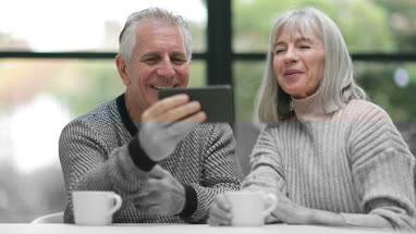 Senior businesswoman opening shop