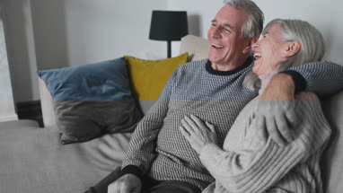 Senior businesswoman working in office using smartphone