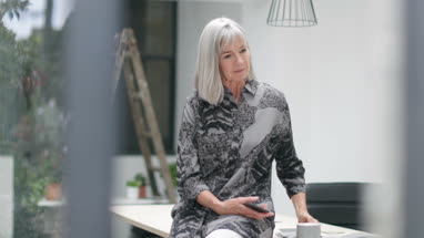 Senior man downloading photos to a computer