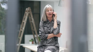 Senior man working on a computer in home office