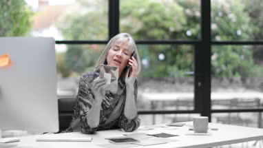 Senior couple at home using a laptop