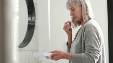 Senior couple sitting on a bench looking at sea view