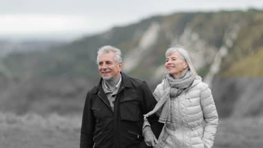 Senior couple walking outdoors