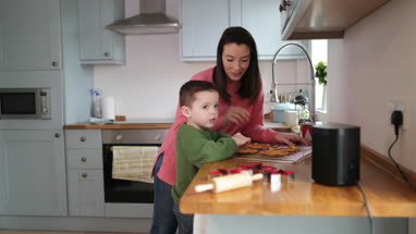 Boy asking digital assistant a question