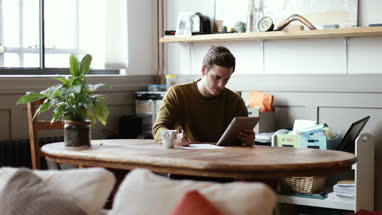 Young male with digital tablet and application