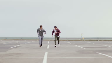 Male friends jogging outdoors