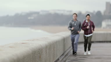 Male friends jogging outdoors
