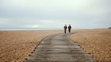 Male friends jogging outdoors