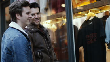 Young male couple window shopping