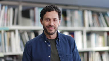 Portrait of mature student in college library