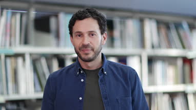 Portrait of mature student in college library