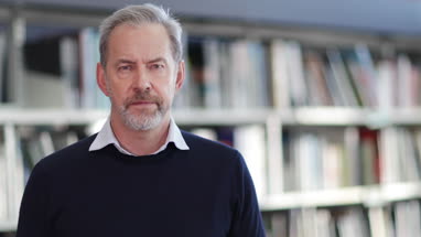 Portrait of mature student in college library