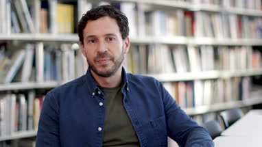 Portrait of mature student in college library