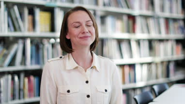 Portrait of mature student in college library