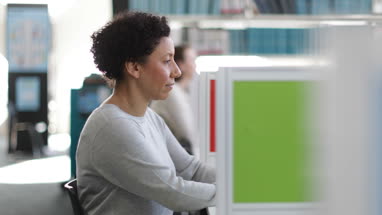 Portrait of mature student in college library