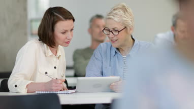 Female mature students working together on a course