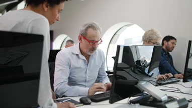 Senior man on computing course