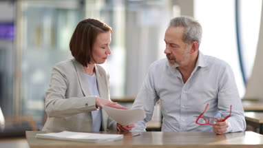 Senior man with personal finance advisor