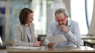 Senior man with personal finance advisor