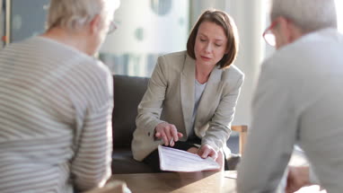 Senior couple with financial advisor