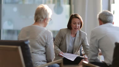 Senior couple with financial advisor