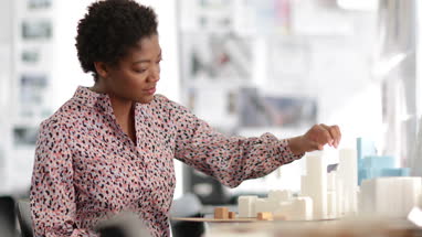 Architect working on scale model