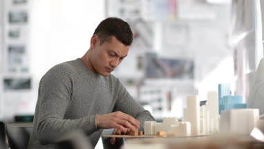 Architect working on scale model