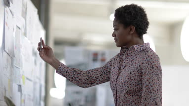 Designer taking photo of work with smartphone