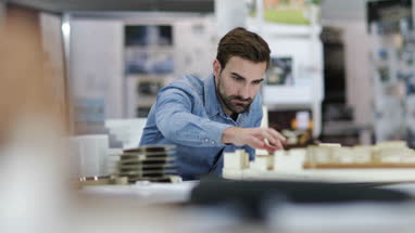 Architect studying model