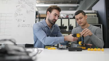 Colleagues working on robotics