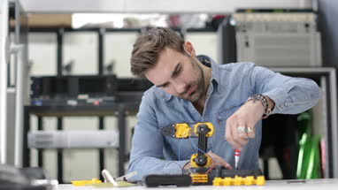 Young adult working on robotics