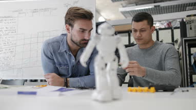 Colleagues working on robotic technology