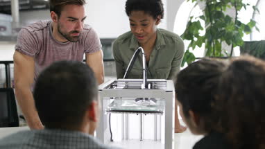Team working with 3D printer